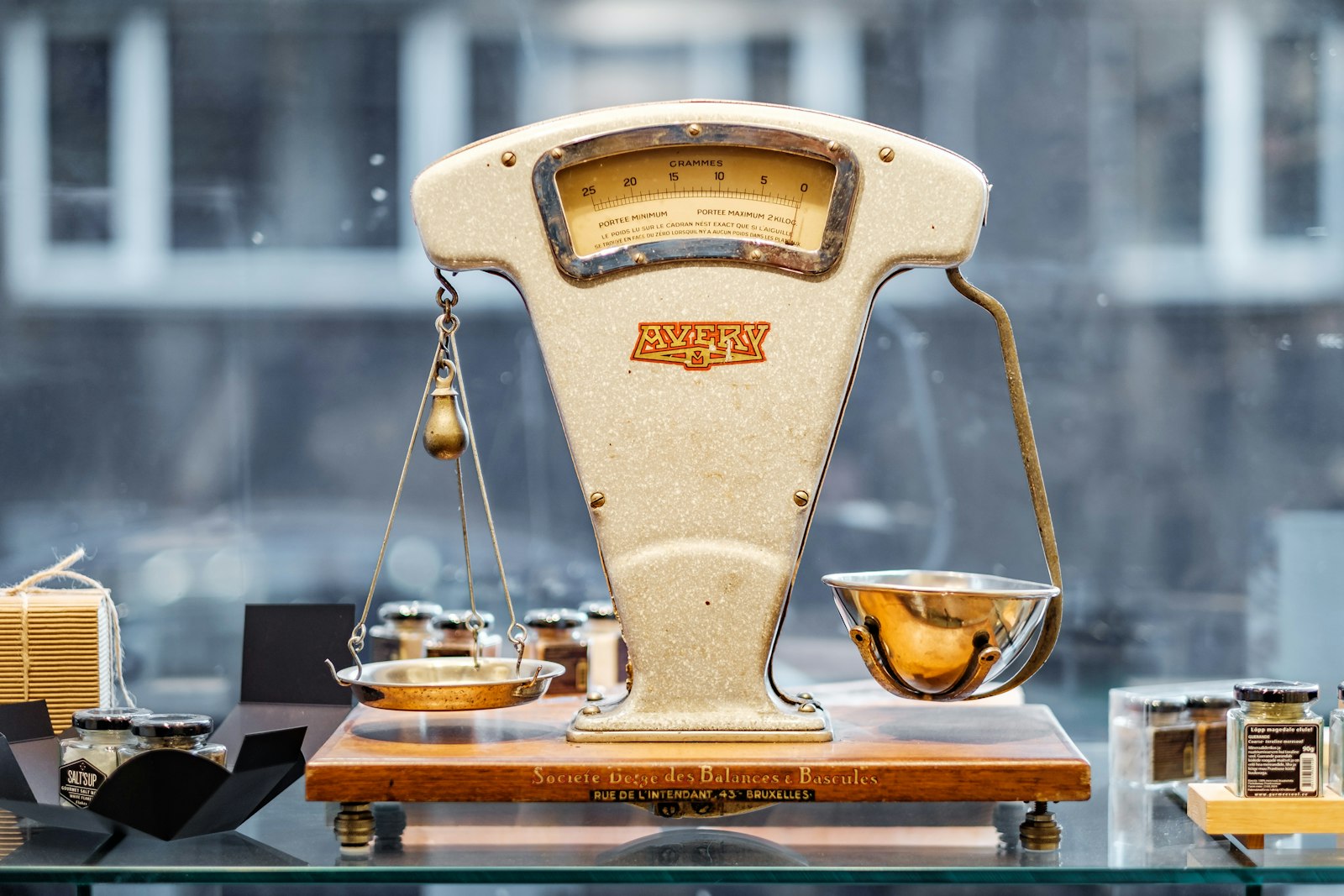 A brass balance scale, the kind we weigh your gold and silver on, in front of you